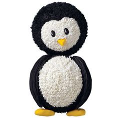 a black and white penguin stuffed animal on a white background