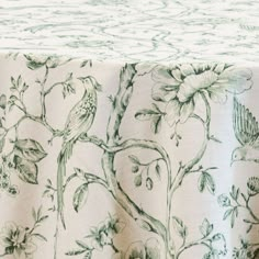 a table cloth with flowers and birds on it