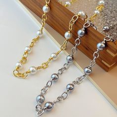 Fashion Element: Round Style: Retro Alloy Link Clavicle Chain Necklace, Alloy Clavicle Chain Link Necklace, Alloy Chain Link Necklace For Gift, Chunky Link Chain Necklace In Alloy, Metal Pearl Chain Link Necklace, Round Alloy Chain Necklace, Alloy Pearl Chain Necklace For Gift, Pearl Chain Necklace In Alloy As Gift, Gold Pearl Necklace With Chain