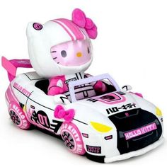 the hello kitty car is white and pink