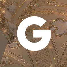 the g logo overlaid with gold glitters on a white background is featured in this image