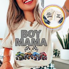 a woman wearing a shirt that says boy mama with cars printed on the front and back