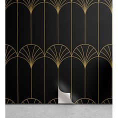 art deco wallpaper in black and gold with an abstract design on the back ground