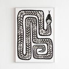 a black and white drawing on a wall with the letter g in it's center