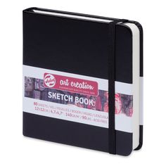 a black and white notebook with the words sketch book on it's front cover