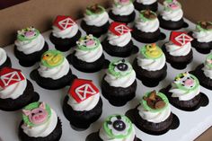 there are many cupcakes with farm animals on them