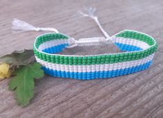 Loom beaded bracelet with Liberia flag. Patriotic hand woven beaded wristbandt is a great gift for a women, girl or child for birthday, Christmas, Valentine's Day and other holidays. Small frienship gift whis African country flag. Is suitable for daily wear. Bracelets in stock and ready to ship. More bracelets here: https://www.etsy.com/shop/BeadSeeShop?ref=seller-platform-mcnav&section_id=30144819 The bracelet is made of Czech seed beads and strong nylon thread. Width 15mm (0.6 inch) The length Casual Handwoven Beaded Bracelets As Gift, Casual Handwoven Bracelets For Gifts, Handwoven White Beaded Bracelets For Gifts, White Handwoven Beaded Bracelets As Gift, Adjustable White Handwoven Beaded Bracelets, Handwoven Bracelets As Summer Gifts, Handwoven Summer Bracelets As Gifts, White Handwoven Beaded Bracelets For Friendship, Summer Woven White Beaded Bracelets