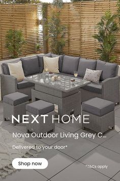 an outdoor living room with grey furniture and plants