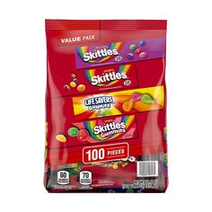 three packs of skittles on a white background