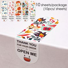 an open box with flowers on it and the words thank you for your order written below