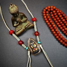 This portable Gau shrine was handcrafted by Tibetan artisans.  Its theme is mani jewel, a treasure vase on a lotus base, inside the vase are mani jewels and other jewels. Each exquisite pattern on it is meticulously hand-carved,and it is embellished with the technique of gold inlay, with cold iron and pure silver inlaid on the red copper material and gold-plated on the pure silver material,inlaid with turquoise and agate bead. Spiritual Gemstone Jewelry For Festivals, Carved Round Beads Jewelry For Meditation, Traditional 108 Beads Jewelry Gift, Spiritual Gemstone Necklace For Puja, Artisan Jewelry For Festivals And Gifts, Artisan Jewelry For Festivals Or Gifts, Spiritual Gemstone Necklaces For Rituals, Ceremonial Carved Amulet Jewelry, Round Beads Jewelry For Meditation And Festivals