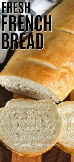 a loaf of fresh french bread sitting on top of a cutting board