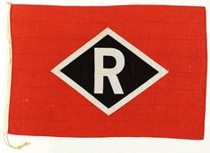 a red and black flag with the letter r on it