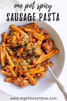 one pot spicy sausage pasta in a white bowl