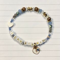 a bracelet that says i love my family on it with a heart and two charms