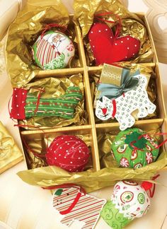 an open box filled with assorted christmas ornaments