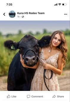 a woman in a dress is hugging a cow