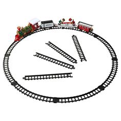 a toy train set is shown in the shape of a circle with santa's sleighs on top