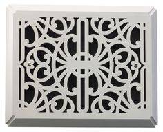 a white decorative ventilator cover with an intricate design on the front and sides