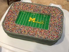 a football field cake with sprinkles on it