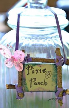 there is a glass jar with a sign on it that says pixre punch