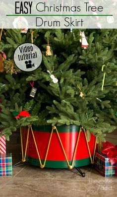 a christmas tree in a red and green tinsel bucket with presents under it, next to the words easy christmas tree drum skirt