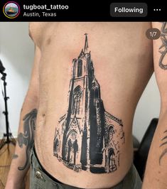 a man with a tattoo on his stomach has a church in the back and is holding a guitar