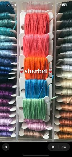 several different colors of yarn in a box