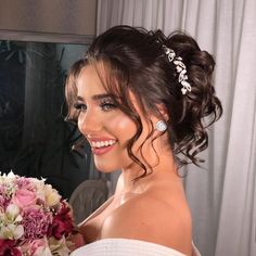 a beautiful woman holding a bouquet of flowers