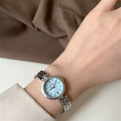 Welcome to AffordLuxe Watches! We're delighted to have you here in our store 🤩 This elegant silver watch features a unique honeycomb bracelet design and a sky-blue dial. The stainless steel band is composed of intricate hexagonal links, creating a modern and sophisticated look. The minimalist dial showcases silver-tone hands and markers, making it a stylish accessory for any occasion. ★Material: - Stainless Steel  - Glass - Mother of Pearl ★Dimensions: - Case Height: 8mm - Case Width: 24mm - Ca Trendy Silver Watch With Metal Dial, Silver Minimalist Metal Watch, Silver Minimalist Metal Watches, Minimalist Silver Analog Watch, Trendy Silver Watch For Formal Occasions, Trendy Blue Watch For Gift, Minimalist Silver Watches With Bracelet Strap, Minimalist Silver Watch With Bracelet Strap, Trendy Metal Round Watches