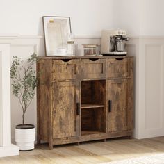 a wooden cabinet sitting next to a fire place in a living room with white walls