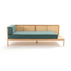 a blue couch sitting on top of a wooden table