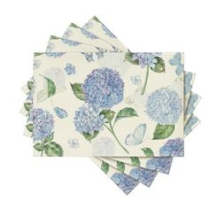 four napkins with blue flowers and butterflies on them