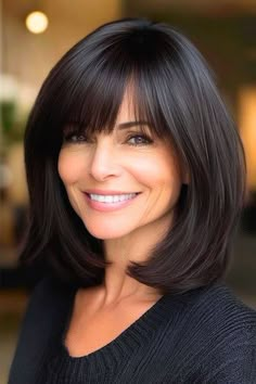 Save this pin for the best medium-length hairstyles for women over 50 with bangs. Rounded edges give this long bob (lob) style a bit more shape and volume, making it feel fuller. The bangs soften the look and give it some extra style. Long Bob With Side Bangs, Bob With Volume, Long Hairstyles With Bangs, 70 Hair, Bob With Side Bangs, Low Maintenance Short Haircut