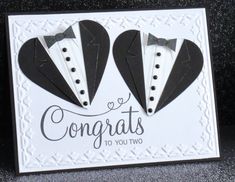 two black and white paper hearts with the words congrats to you on them