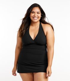 Made of breathable, quick-drying, chlorine-resistant Italian fabric, this swimsuit is made of two parts: a one-piece suit underneath for comfort and coverage, with a lightweight and flattering swimdress on top. Compressive fit Front length from shoulder: Regular 30", Plus 32. 5", Long 32. 25" Falls at thigh Body Content: 72% nylon, 28% Lycra® Xtra Life Liner Content: 73% nylon, 27% Lycra® Xtra Life Handwash, line dry. Stretch & Recovery: Yes, Xtra Life preserves fit for stretch that won't stretc Shaping Swimwear, Active Swimwear, Dress Royal, Black Halter Dress, Swimwear Tankini, Active Outfits, Dresses Royal, One Piece Suit, Dress Cover