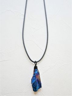 Blue titanium quartz necklace wrapped in black wire. Suitable for women or men. Size of stone: about 3cm Length of necklace: 18 inches, with 2 inches extender.  ------------------------------------------------ The price is for one necklace. Please kindly understand that every crystal is natural and they are not perfect, but they are both gorgeous. I will send the crystal to you randomly. It may not exactly the same with the one in pictures but they are comparable in size, color and quality. If y Raw Quartz Necklace, Cotton Jewelry, Titanium Quartz, Raw Quartz, Necklace Crystal, Necklace Gemstone, Quartz Necklace, Cord Necklace, Jewelry Bags