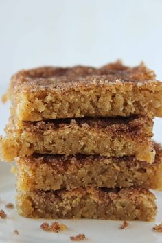 three pieces of cake sitting on top of a white plate with the words how to make churro bars