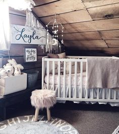 a baby's room with a crib, bed and rugs on the floor