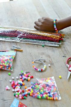 a table topped with lots of different types of beads