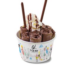 an ice cream sundae with chocolate and whipped cream on top, in a paper cup