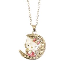 a hello kitty sitting on the moon necklace