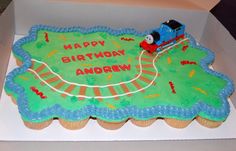 a birthday cake in the shape of a train