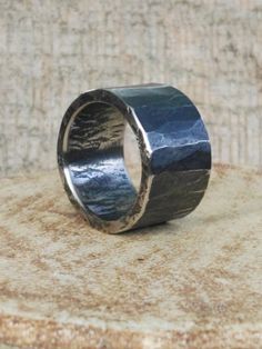 This very wide men's hammered ring, band is handmade from stainless steel. Using traditional blacksmithing techniques of fire, hammer and anvil. Surface texture is achieved through different shaped hammers and hand held chisels and profiling tools. Width- 15.5 mm I can make this ring in a variety of sizes. PLEASE LET ME KNOW WHAT SIZE RING YOU NEED, and I will try my best to accommodate you. No two rings are ever a like. Presented in a gift bag. European & International orders are sent by St Hammered Ring Men, Hammered Bracelet, Mixed Metal Rings, Rustic Rings, Hammered Rings, Wide Rings, Copper Rings, Steel Ring, Unisex Jewelry