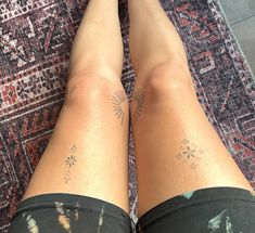 the legs of a woman with tattoos on them