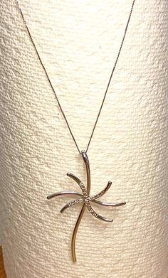 SALE REG PRICE $ 699.00       Add a touch of exotic elegance to your look with this stunning 14k white gold necklace featuring a palm tree pendant with 16 natural diamonds. The diamonds are set in a prong style for security of the stones. My guess is 0.50 ctw but it is only an estimate. The necklace is 20 inches long and comes with a spring ring closure, ensuring a secure and comfortable fit. The necklace is made of high-quality 14k white gold and is perfect for any occasion. The 16 natural diamonds add a touch of glamour to the pendant, making it an excellent addition to any fine jewelry collection. This necklace is a must-have for anyone who wants to add a touch of luxury to their wardrobe, and weighs in at 6.9 grams. At under  $100 per gram for the gold, the diamonds are free! Palm Tree Jewelry, Palm Tree Pendant, Pendant Making, Tree Jewelry, White Gold Necklace, White Gold Necklaces, Tree Pendant, Fine Jewelry Collection, Fine Jewellery Necklace