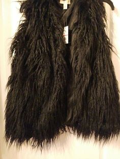 CUPIO Black Faux Fur Shag Sleeveless Retro Vest Jacket Womens Size S($98). Pit to Pit measures approximately 17.5 inches. Condition is New with tags. Shipped with USPS Priority Mail. Black Winter Vest For Night Out, Sleeveless Outerwear With Faux Fur Lining For Fall, Sleeveless Fall Outerwear With Faux Fur Lining, Trendy Fall Vest For Party, Black Vest For Night Out In Fall, Sleeveless Vest For Night Out In Winter, Trendy Fall Party Vest, Black Vest Outerwear For Night Out, Fall Party Outerwear Vest