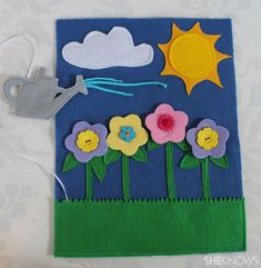 a card with flowers and clouds on it