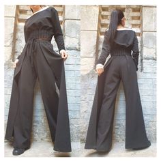 "Spectacular cotton two-piece set. Short blouse with long sleeves and open neck in a combination of black and white and ankle-length pants with a high waist with ties at the waist. The pants have a wide leg and sewn two rails on both sides that give asymmetry and elegance🤩Extravagant designs and high quality fabrics. The item from the pictures is size S  For more information feel free to ask questions. Material &Care Cotton and elastane  Machine wash 30oC Hand wash at low temperatures Do not ma Cotton Two-piece Long Sleeve Sets, Cotton Two-piece Set With Long Sleeves, Fitted Cotton Wide Leg Sets, Fitted Cotton Sets With Wide Leg, Fitted Cotton Set With Wide Leg, Lady Pants, Short Blouse, Gothic Pants, Gothic Costume