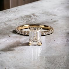 a diamond ring sitting on top of a counter